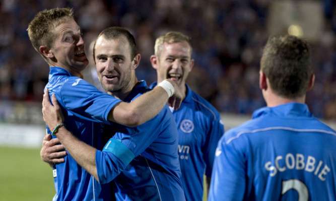 Steven MacLean (left) and Dave Mackay (centre) celebrate at full time.