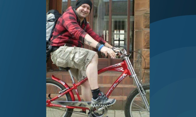 Douglas Illingworth on his restored beach cruiser.