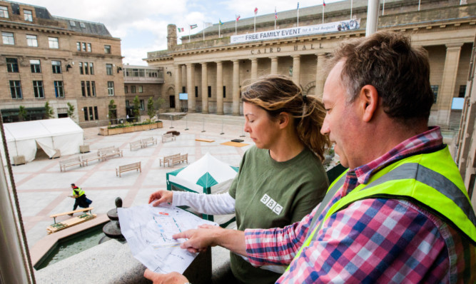 World War One At Home production manager Karen Hunt and executive producer Moray London look at site plans from the vantage point of the City Chambers balcony.