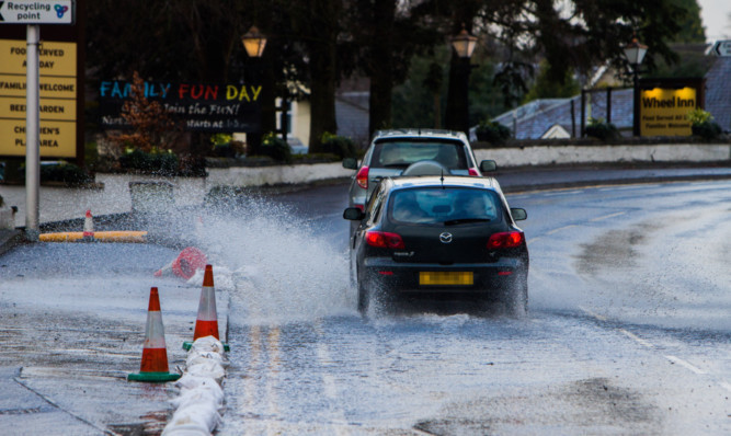 Flood water being redirected down the main road from the Wheel Inn car park in Scone earlier this year.