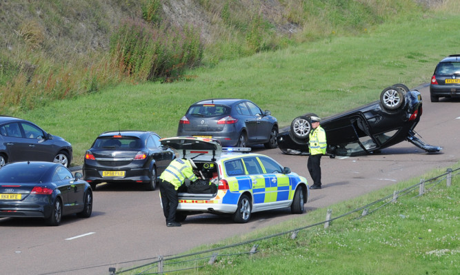 The black Vauxhall Corsa flipped onto its roof on the A92 near the Muirdrum junction.