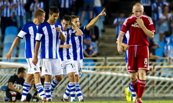Real Sociedad substitute Sergio Canales (right) celebrates his goal with fellow team-mates.