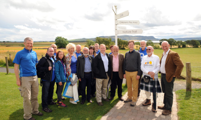 Deputy Prime Minister Nick Clegg, fourth from right, joined Scottish Liberal Democrat leader Willie Rennie, far left, and a number of ramblers at Loch Levens Larder.