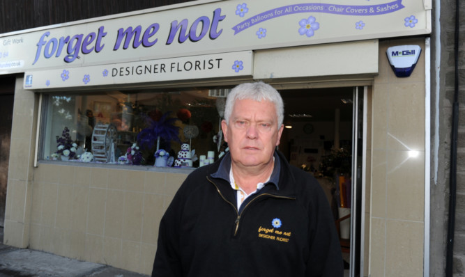 Businessman Bruce Ransford outside Forget Me Not Flowers on Strathmartine Road.