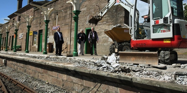 DOUGIE NICOLSON, COURIER, 24/05/11, NEWS.
DATE - Tuesday 24th May 2011,
LOCATION - Caledonian Railway, Brechin.
EVENT - Work starts on weather damaged platform.
INFO - L/R, Cllr Bob Myles - Leader of Angus Council,Angus Provost Ruth Leslie Melville and Andrew Webster - Chairman of the Caledonian Railway (Brechin Ltd), look at the progress of the work.
STORY BY - Forfar office.