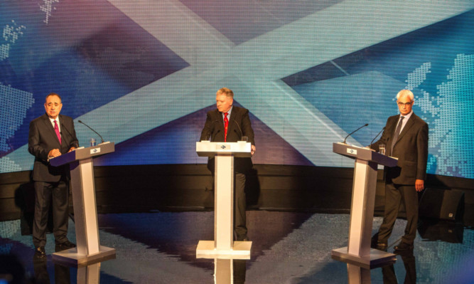 Alex Salmond, STV's Bernard Ponsonby, and Alistair Darling during the independence referendum debate in Glasgow.