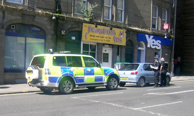 Armed police at an incident in Dundee's Seagate.