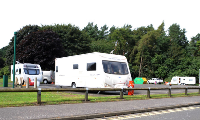 Caravans and motorhomes in the overspill car park at Kirkcaldy Crematorium.
