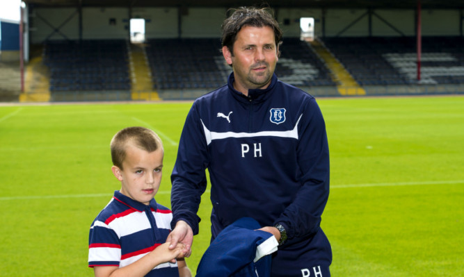 Paul Hartley with Rhys Williamson, who presented the SPFL Championship 2013/2014 winners flag to the Dundee manager.
