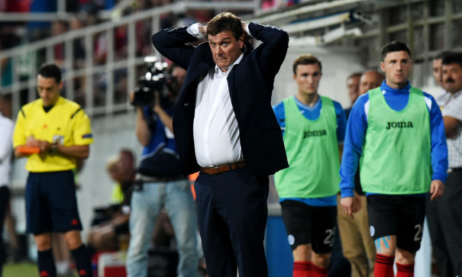 St Johnstone manager Tommy Wright looks on from the dugout.