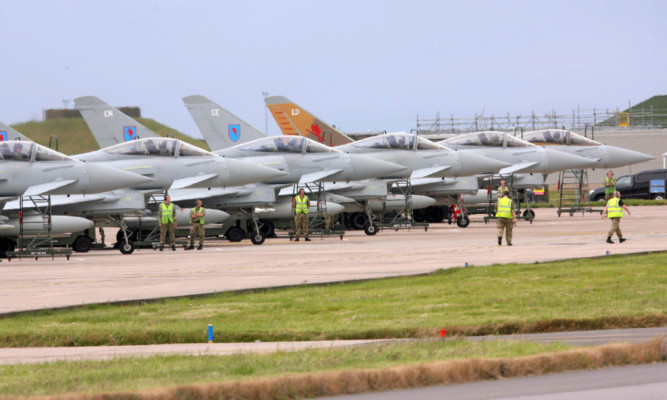 RAF Typhoons touch down at RAF Lossiemouth.