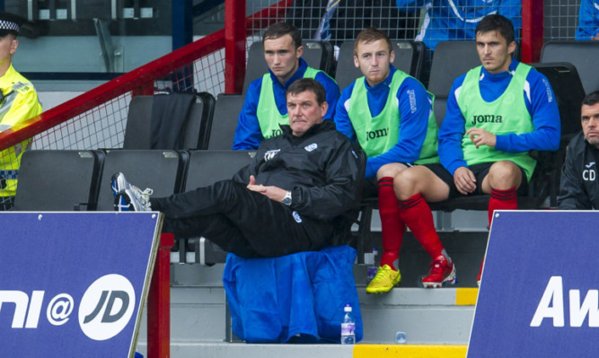 Tommy Wright puts his feet as St Johnstone ease to victory on their opening match of the season.