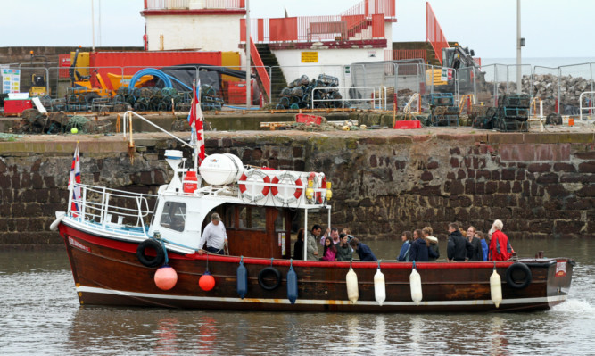 Visitors enjoy a boat trip.