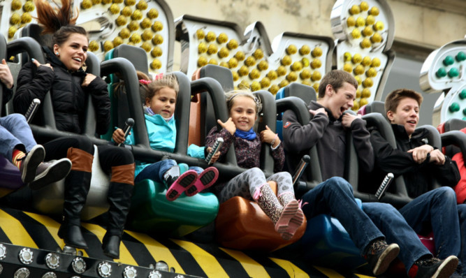 Having fun on one of the rides at the Lammas Market.