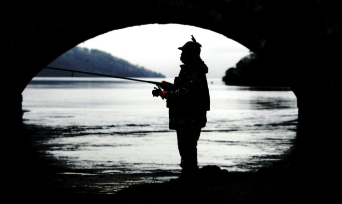 An angler on the River Tay near Kenmore.