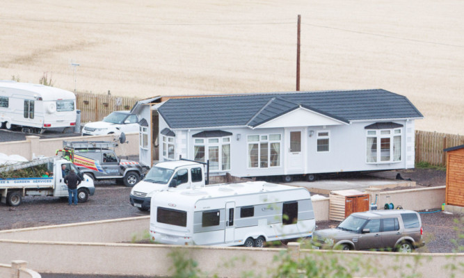 The Travellers add a large static caravan to their illegal site.