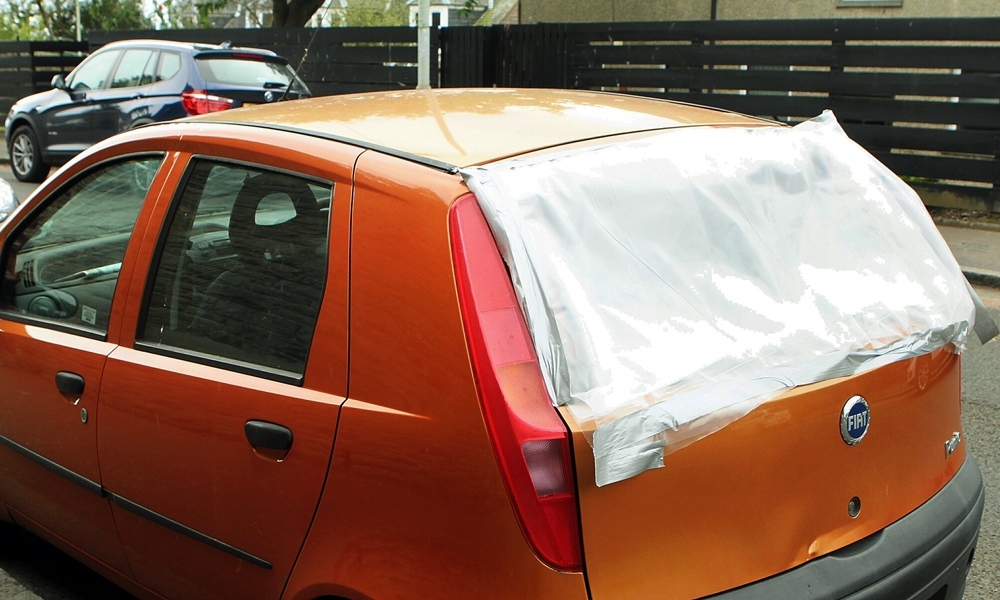 John Stevenson. Courier. 16/08/14. Dundee. Pics to illustrate car vandalism in Albany Terrace/Inveresk and Rankine Street area. This Fiat car had a microwave oven put throught the rear window.