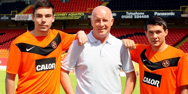 John Stevenson, Courier,03/06/11.Dundee. Tannadice,Dundee United launch new home strip for season 2011/12.Pic shows  United manager Peter Houston with  players Ryan Dow(left) and Dale Hilson(right)