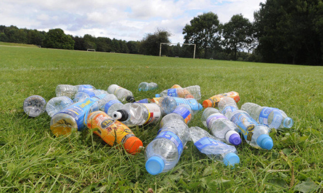 Some of the empty bottles rounded up after being left by teams playing on the pitches at the former St Saviours High School on Drumgeith Road.