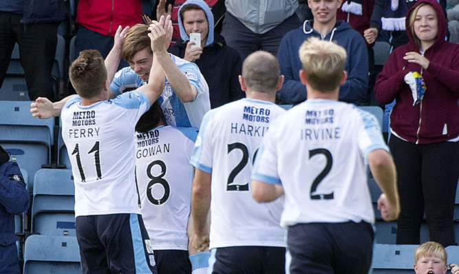 Craig Wighton, second left, is hoisted into the air as he celebrates his equaliser.