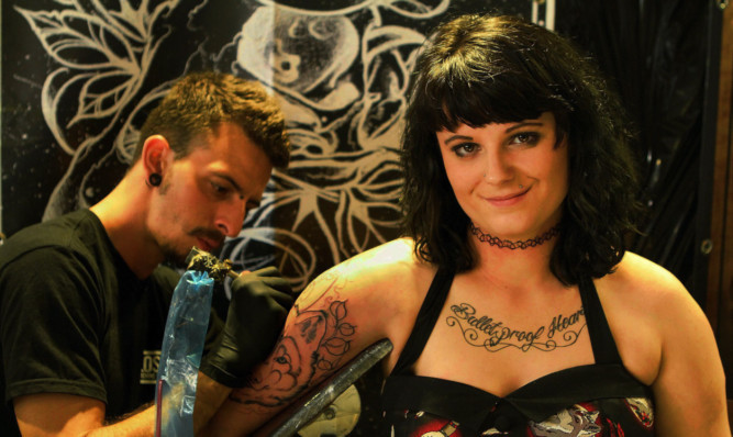 Lucy Derry with tattooist Eric Moreno.