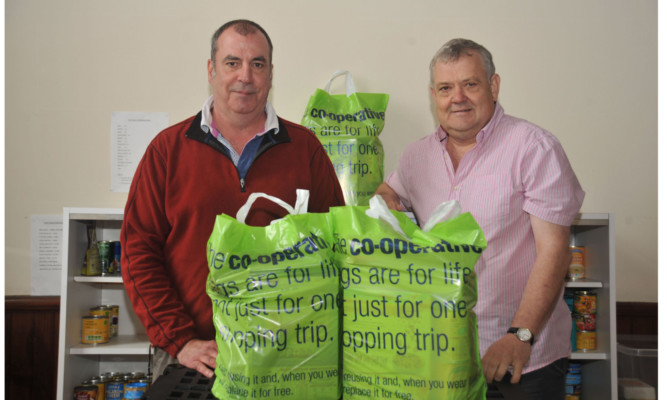 East Neuk Food Bank coordinator Bill King and energy benefits adviser Norman Cowie at Cellardyke Church.