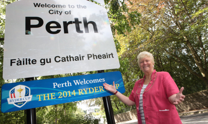 Provost Liz Grant with one of the new signs.