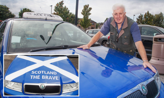 Alex Chivers with his taxi bonnet returned to its previous state and (inset) the cab when it had the slogan.