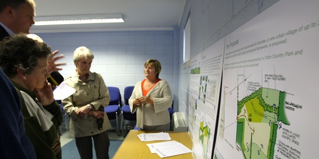 Kris Miller, 15/06/11. Picture today at Millenium Hall, Birkhill shows members of the public studying the plans for the 'Urban Village' near Clatto.