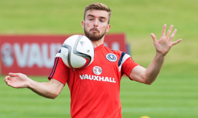 James Morrison gets on the ball at Scotland training.