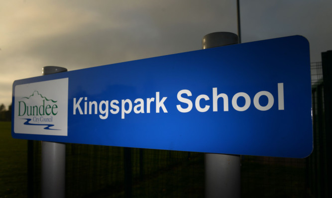 Kim Cessford - 29.04.14 - pictured with 'dramatic' lighting is one of the entrance signs at Kingspark School, Dundee