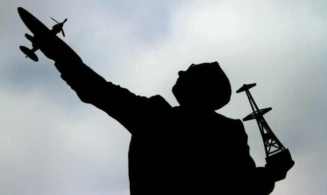 The statue features Watson-Watt holding a radar tower and Spitfire.