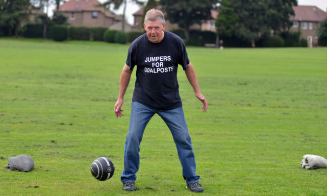 Shane Fenton has a kickabout at the park with alternative goalposts.