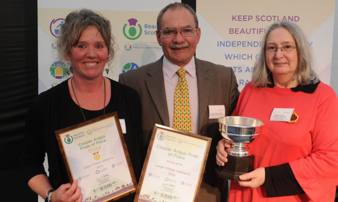 Members of the Coupar Angus team pick up their awards from George Anderson of BBC's Beechgrove Garden.