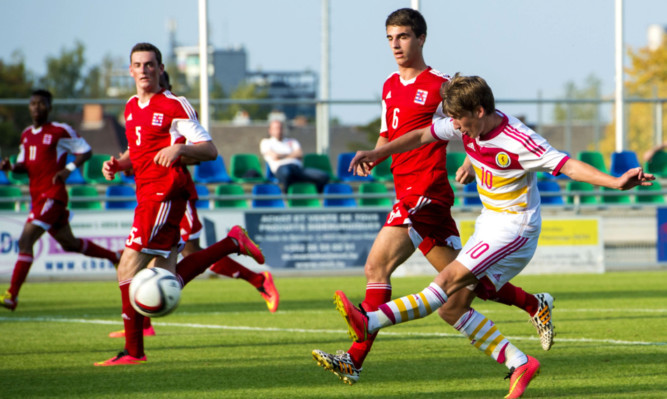 Ryan Gauld scores his second and Scotland U21s' third goal of the game.