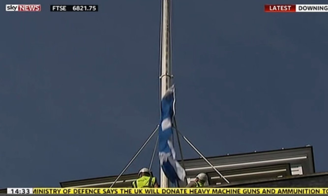 The Saltire comes crashing down during the operation to raise it above Downing Street.