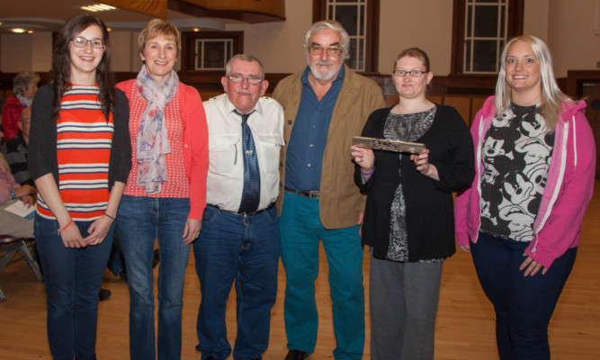 Volunteers Alix Shearer, Helen Shearer, Neil Wallace, Iain Gaul, Amanda Taylor and Alison McGill with a replica of the Commonwealth Games baton.