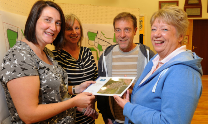 At the consultation event are, from left, Ashleigh Wilson, architect with AB Roger & Young; Karen Clark, of Peterkin Homes, with Bob and Charlotte Craib.