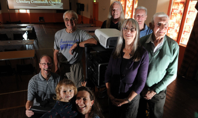 Members of the cinema committee, back, from left: David Aird, Philip Ponton, Robin Watson, Jim Ashton and Ivor Gordon. Front: Annie with mum Jenny Holt-Brook and chair-woman Janet Watson.