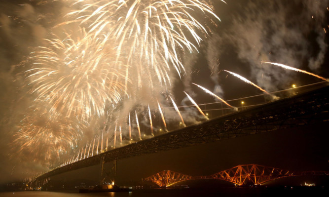 Fireworks go off above the Forth Road Bridge to mark the 50th anniversary of the crossing.