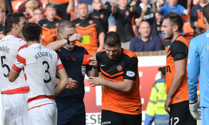 Nadir Ciftci (centre) is sent off after a second yellow card.