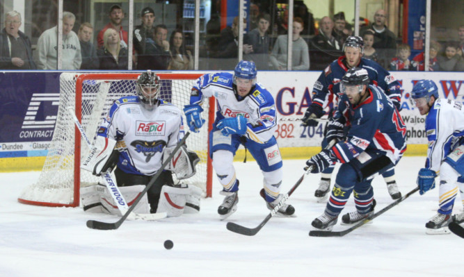 Hull Stingrays defend an attack from Dundee Stars Matt Ryan and Shane Lust in last nights clash at Dundee Ice Arena.