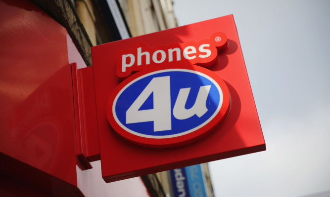 LONDON, ENGLAND - SEPTEMBER 15:  A general view of  Phones 4u shop on Oxford Street on September 15, 2014 in London, England. The Phones 4u retailer which is owned by private equity firm BC Partners, went into administration on Sunday night. The closures are likely to result in the loss of almost 6000 jobs across the UK.  (Photo by Dan Kitwood/Getty Images)