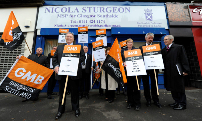 Members of the GMB union hold a protest outside the constituency office of Nicola Sturgeon in Glasgow.