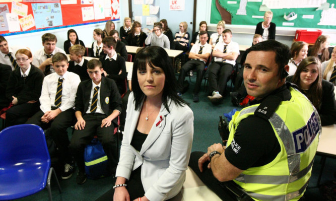 Lisa McLean and Constable Mark McCulloch before Lisas talk to pupils at Kirkcaldy High School.