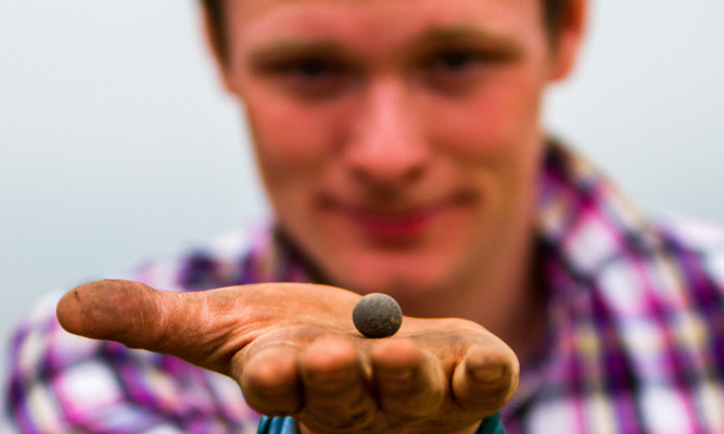 Andrew Cooper found a river pebble probably used as part of a game by the inhabitants of the fort.