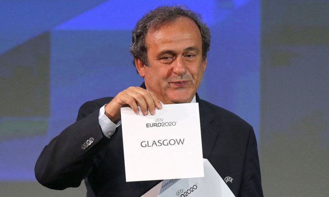 UEFA president Michel Platini announces Glasgow as a host city.