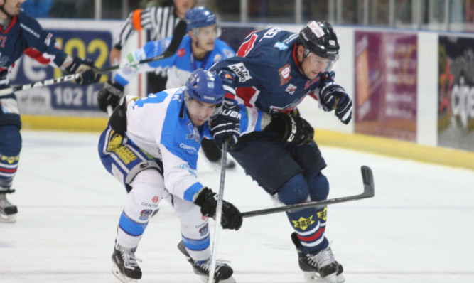 Martin Cingel of Dundee Stars battles with Coventrys Cala Tanaka in mid-ice during last nights clash in Dundee.