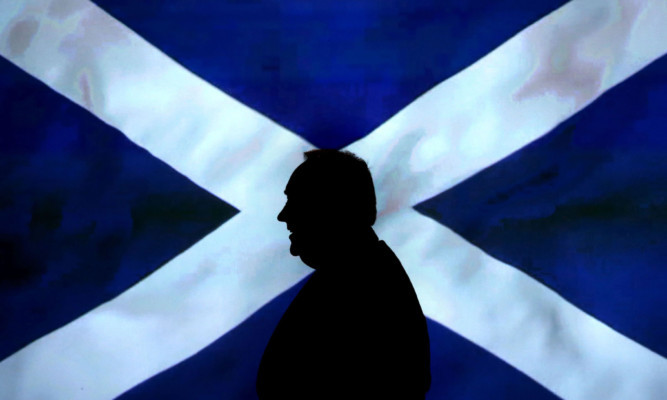 Scottish First Minister Alex Salmond leaves a press conference at St Andrews House in Edinburgh, after an agreement between the UK Government and the Scottish Government was signed for referendum for the independence of Scotland. 15/10/2012