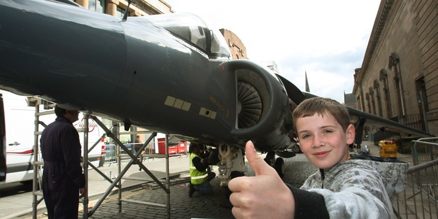 DOUGIE NICOLSON, COURIER, 06/05/10,NEWS.
DATE - Thursday 6th May 2010.
LOCATION - St.John's Place,Perth.
EVENT - Harrier jump jet on display.
INFO - 11 year old Dillon Michie from Perth, gives the Harrier the thumbs up.
STORY BY - Perth office.